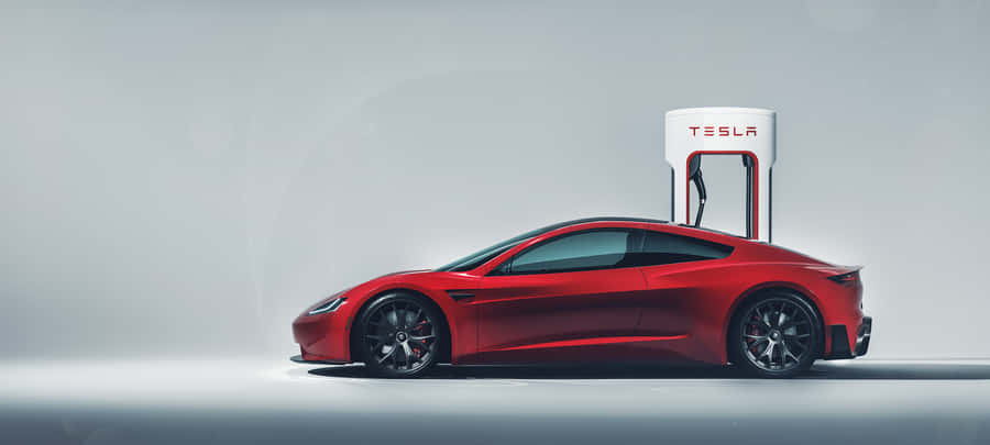 Caption: Tesla Roadster - Unleashing Impeccable Innovation Wallpaper