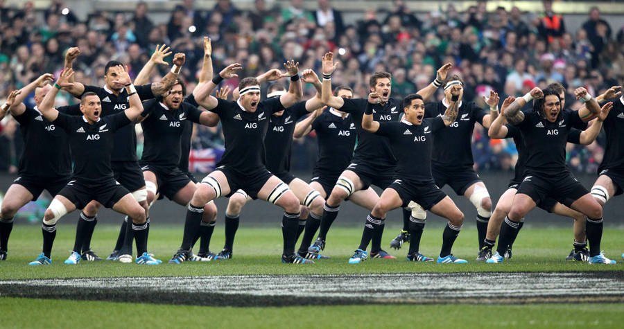 Caption: The All Blacks Rugby Team Performing The Haka Ritual Wallpaper