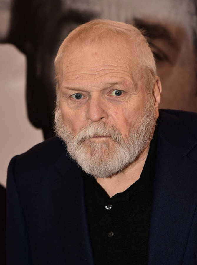 Caption: Veteran Actor Brian Dennehy In A Black Shirt And Gray Beard. Wallpaper