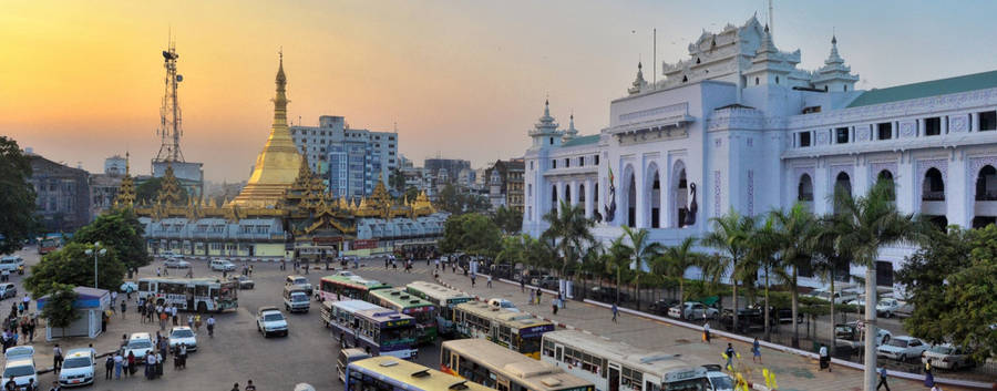 Caption: Vibrant City Life At Yangon City Hall, Myanmar Wallpaper