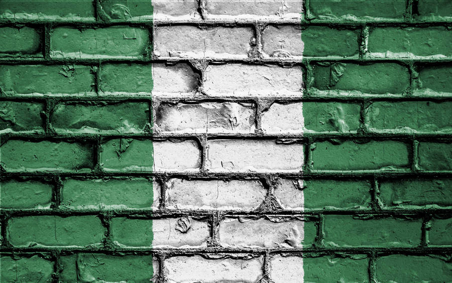 Caption: Vibrant Nigerian Colors On A Vintage Brick Wall Wallpaper