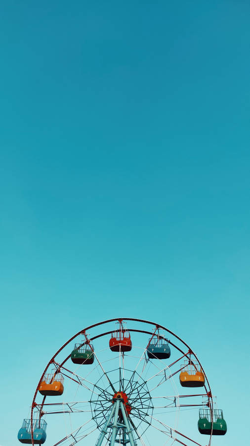 Caption: Whimsical Blue Ferris Wheel In Minimalist Style Wallpaper