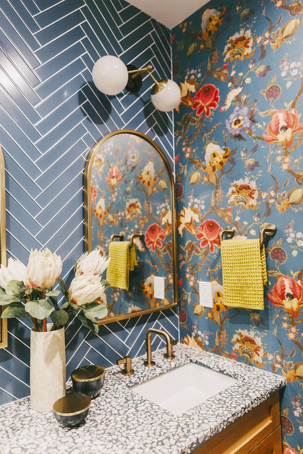 Captivating Arc Mirror In A Flower-patterned Powder Room Wallpaper