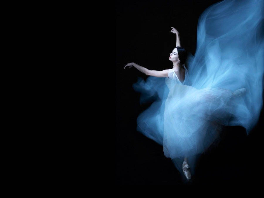 Captivating Ballet Dance In Ethereal Blue Gown Wallpaper