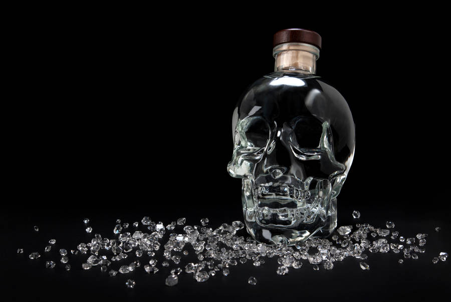 Captivating Crystal Head Vodka With Radiant Shattered Crystals Wallpaper