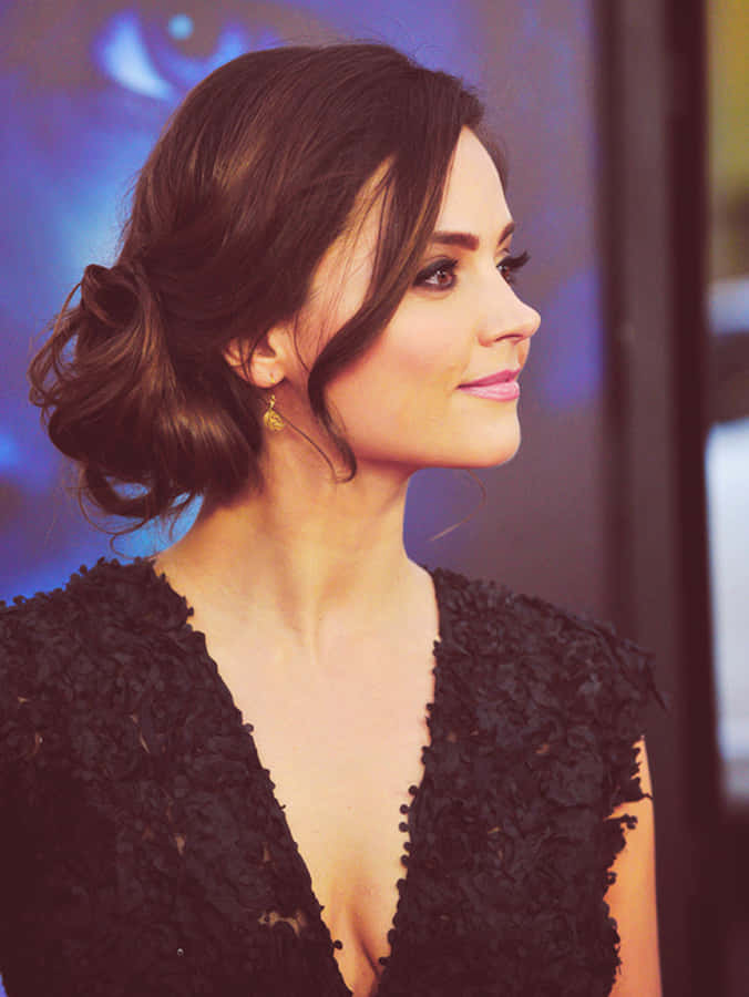 Captivating Jenna Coleman Smiling Radiantly Wallpaper