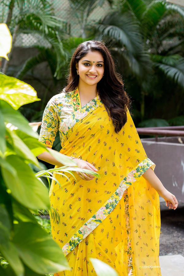 Captivating Keerthi Suresh In Yellow Floral Dress Wallpaper