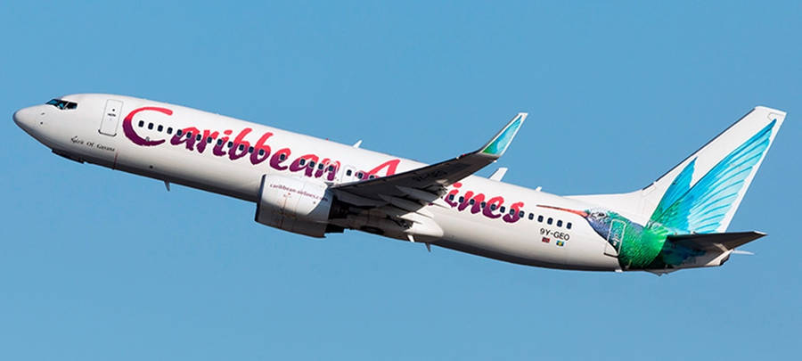 Caribbean Airlines Plane Elevating To The Sky Wallpaper