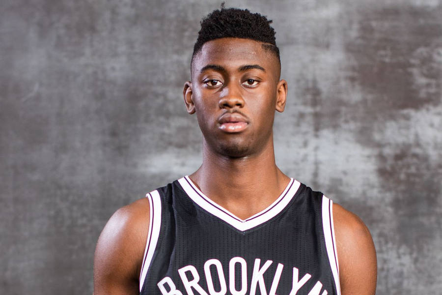 Caris Levert Against Cement Wall Wallpaper