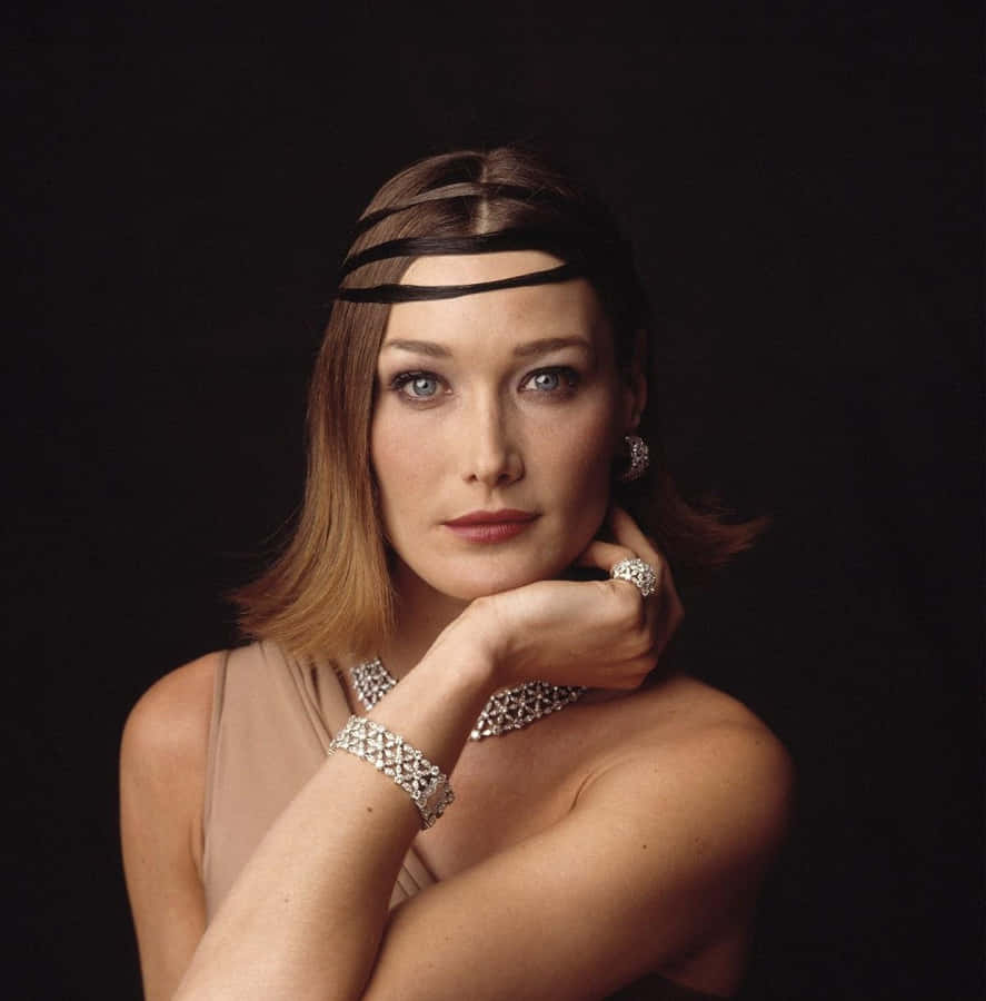 Carla Bruni Elegantly Posed In Mid-performance Wallpaper