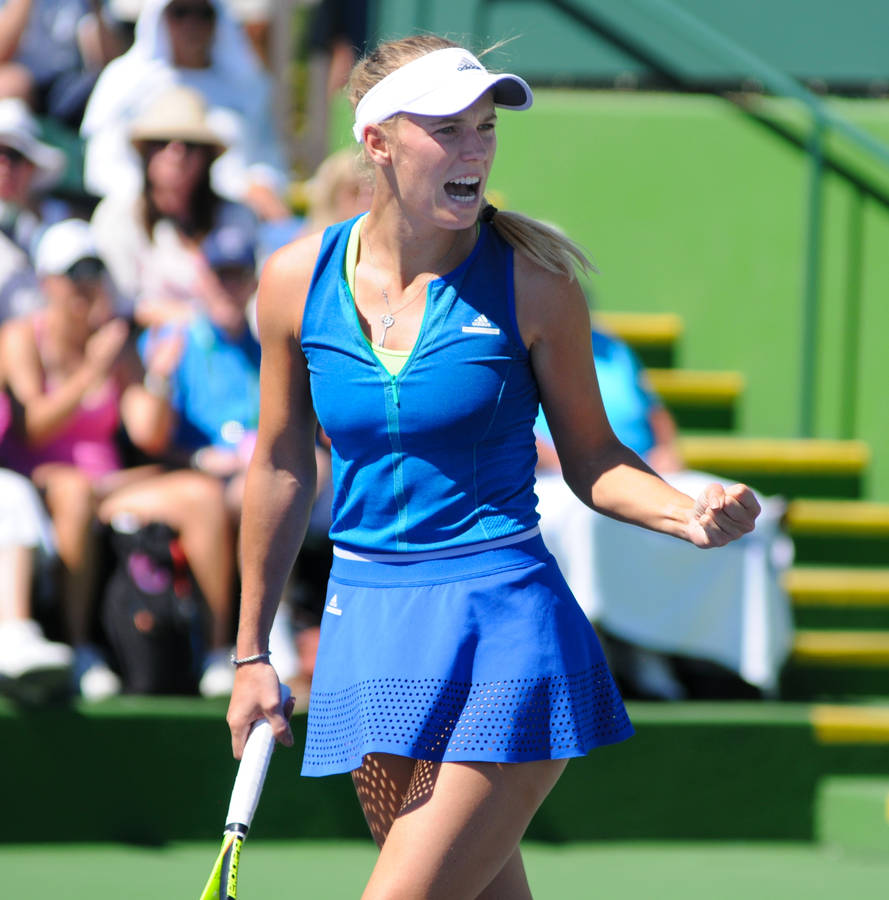 Caroline Wozniacki Wearing Blue Tennis Outfit Wallpaper