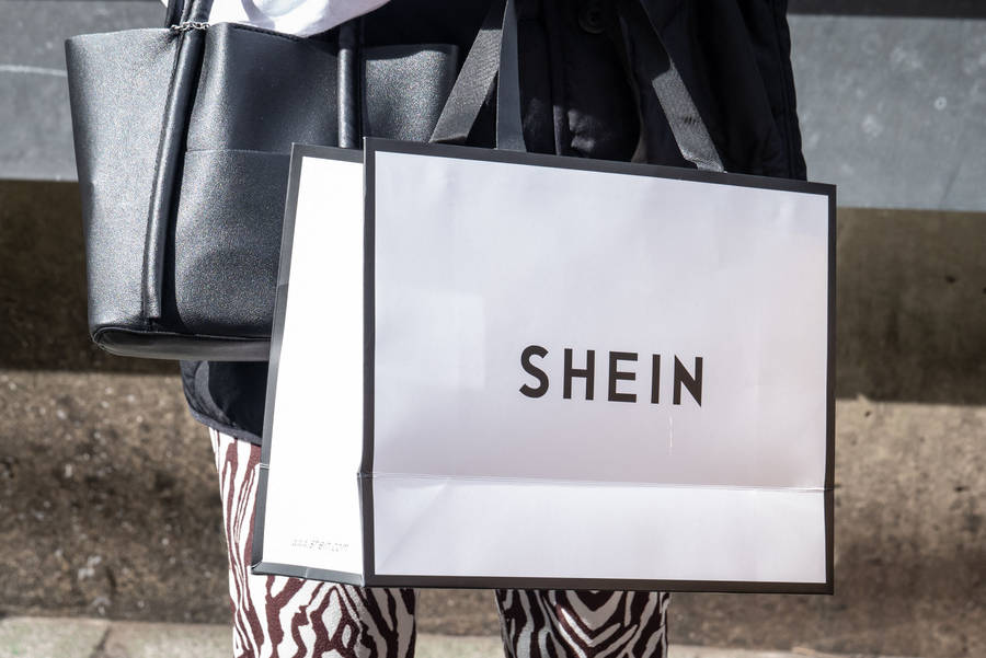 Carrying A Shein Paper Bag Wallpaper