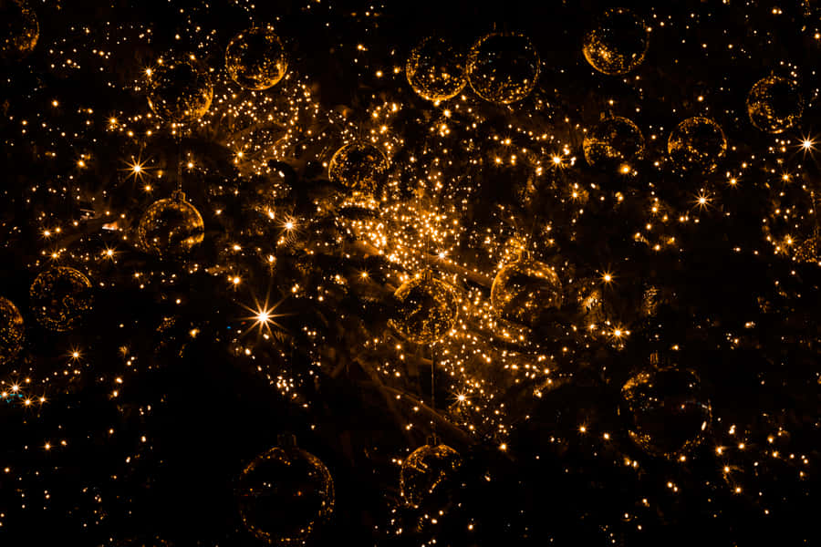 Celebrate Christmas With Gold Decorations Wallpaper