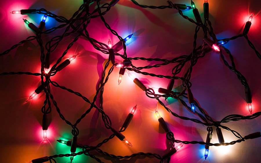 Celebrate The Holiday Season With A Beautiful Display Of Christmas Lights Wallpaper