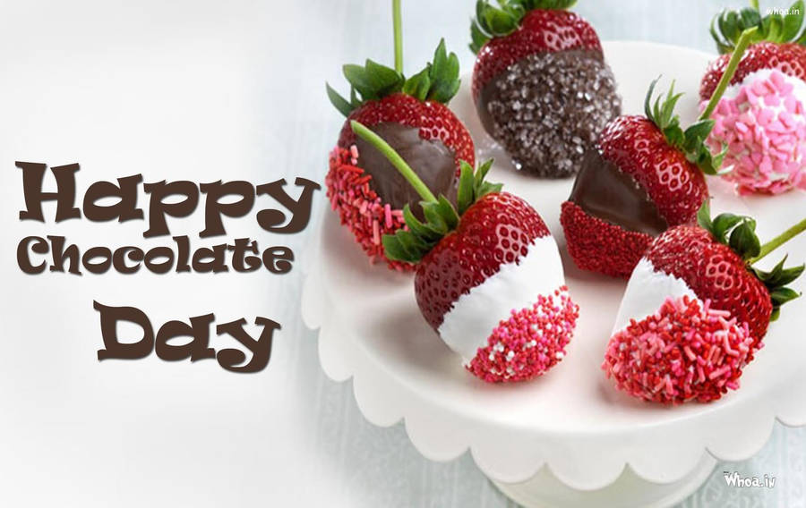 Celebrate The Sweetness Of Life On Chocolate Day With Freshly Dipped Strawberries. Wallpaper