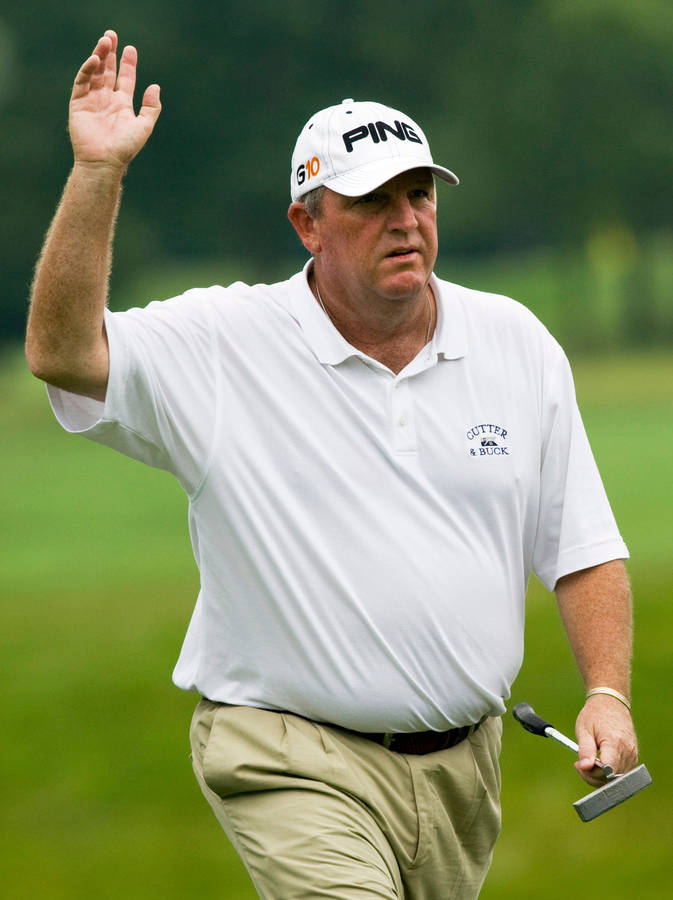 Celebratory Moment Of Mark Calcavecchia In Golf Tournament Wallpaper