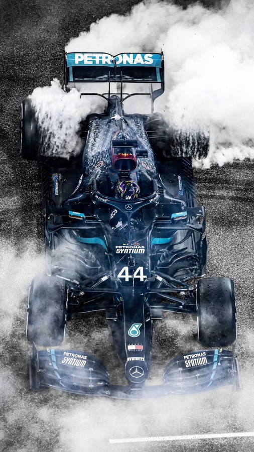 Champion At His Peak - Lewis Hamilton Performing Burnouts Wallpaper