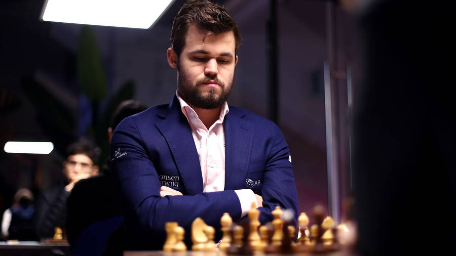 Champion Chess Player Magnus Carlsen In Concentrated Pose Wallpaper