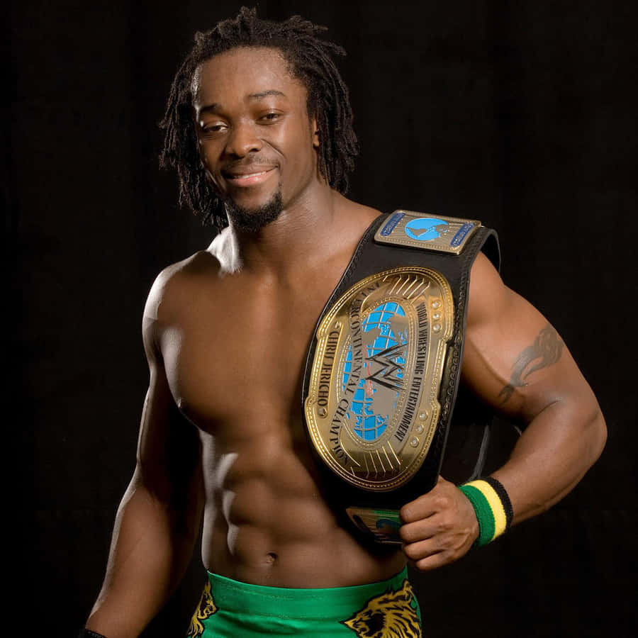 Champion Kofi Kingston Proudly Displays His Wwe Belt. Wallpaper