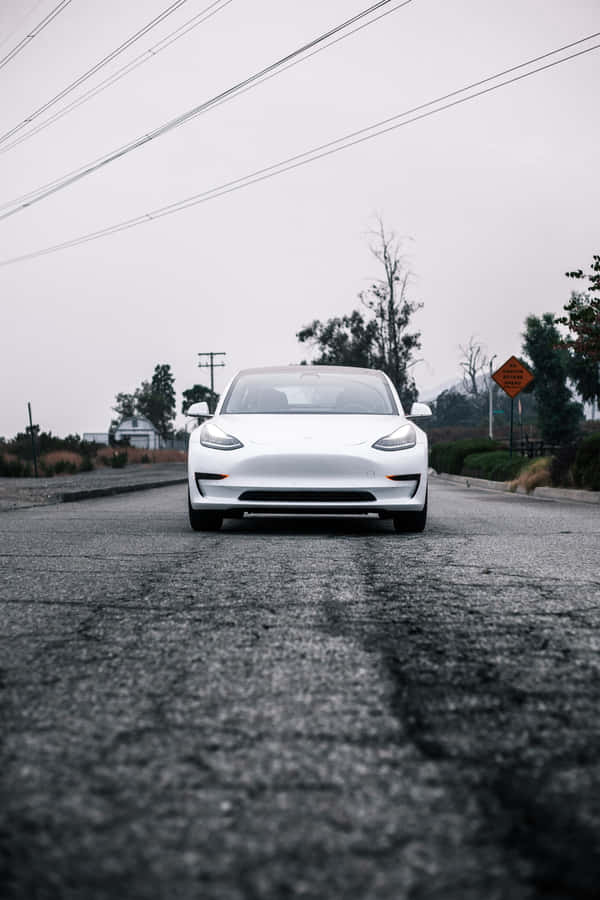 Charge Your Iphone With A Tesla Powerbank Wallpaper