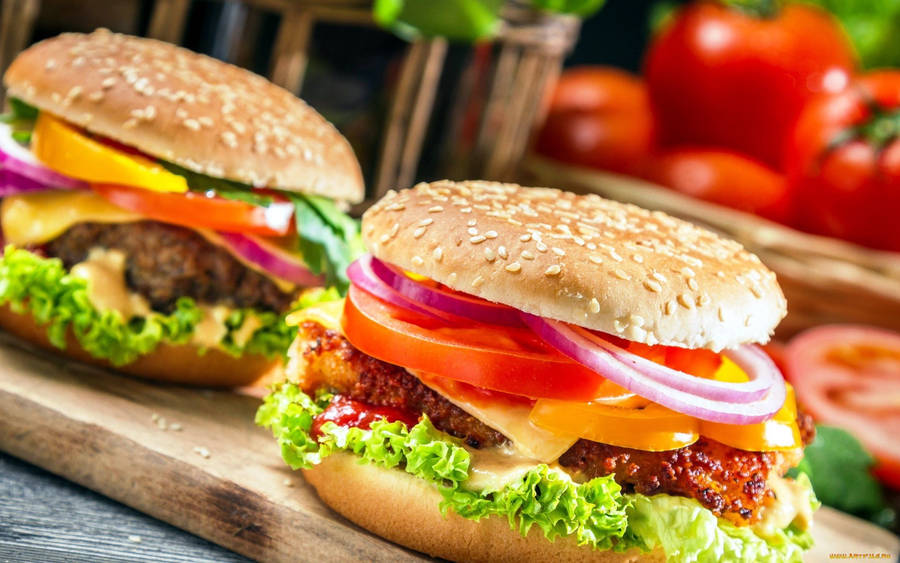 Cheeseburger With Fresh Vegetable Toppings Wallpaper