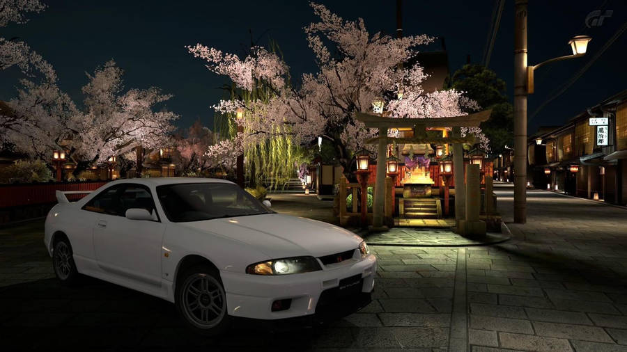 Cherry Blossom Season With The Iconic Nissan Skyline Gtr R33 Wallpaper