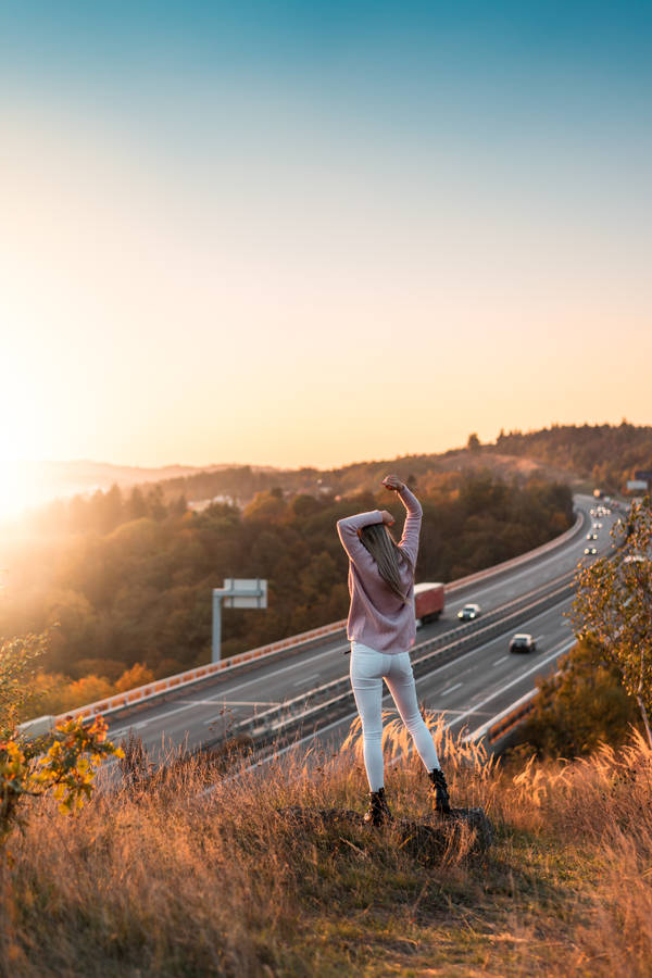 Chill Iphone Woman Enjoying Sunset Wallpaper