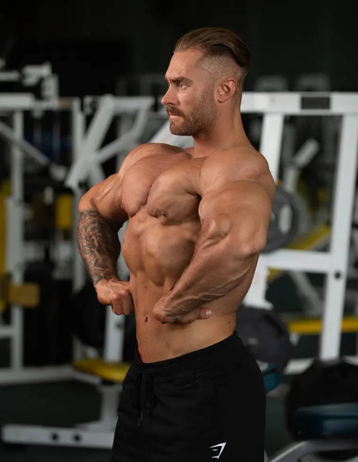 Chris Bumstead Lat Spread Side Profile Wallpaper