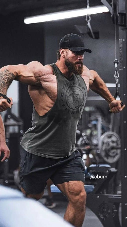 Chris Bumstead Using Cable Gym Equipment Wallpaper