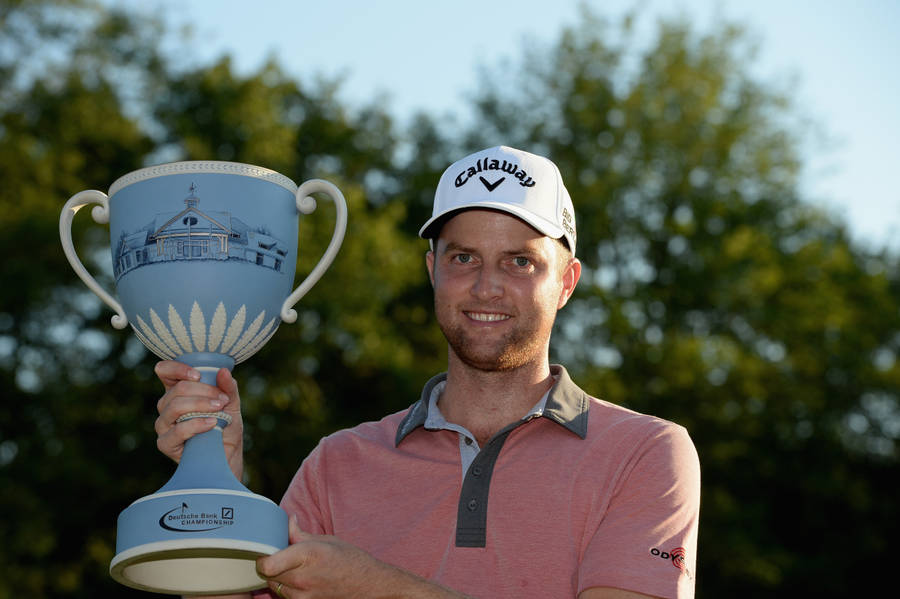 Chris Kirk Triumphant With Trophy Wallpaper