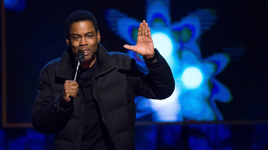 Chris Rock During A Live Stand-up Performance Wallpaper