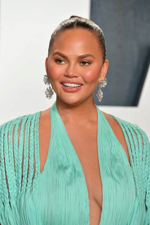 Chrissy Teigen Elegant Green Dress Event Wallpaper