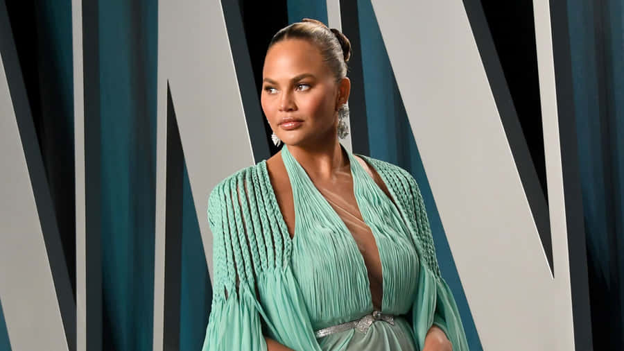 Chrissy Teigen Elegant Green Gown Event Wallpaper