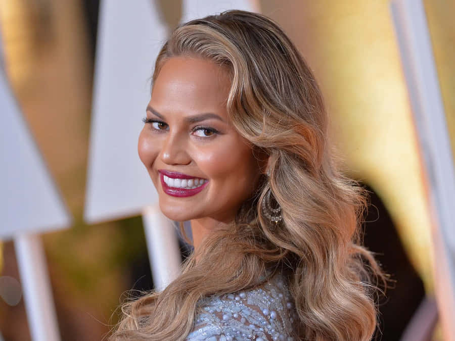 Chrissy Teigen Red Carpet Smile Wallpaper