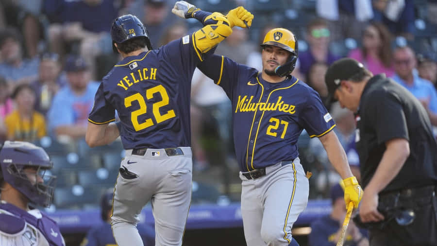 Christian Yelich Celebratingwith Teammate Wallpaper