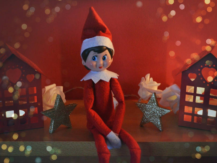 Christmas Elf Figurine On A Desk Wallpaper