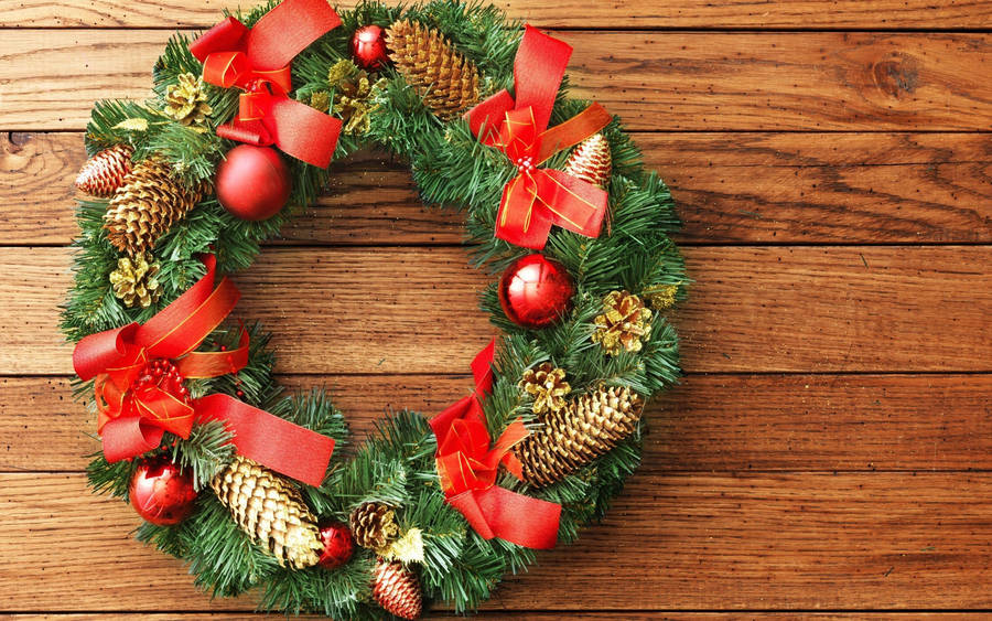 Christmas Wreath On A Wooden Wall Wallpaper