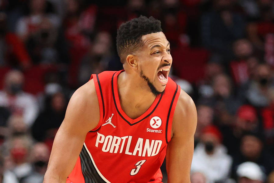 Cj Mccollum Screaming On Court Wallpaper