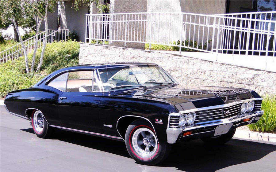 Classic 1967 Chevrolet Impala In Stunning Blue Wallpaper