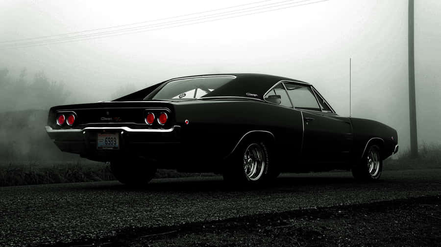 Classic Black Muscle Car Foggy Backdrop Wallpaper