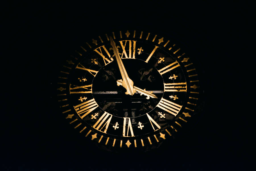 Clock In Gold And Black Wallpaper