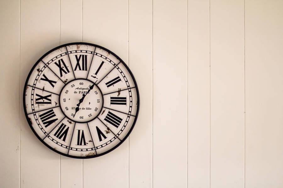 Clock On Beige Wall Wallpaper