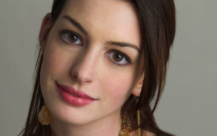 Close-up Portrait Of Anne Hathaway Wallpaper