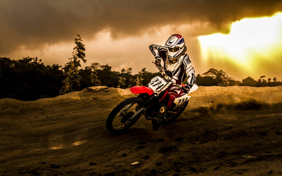 Cloudy Dirtbike Riding Wallpaper