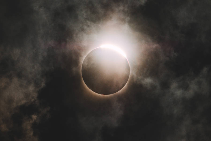 Cloudy Mid-day Solar Eclipse Wallpaper