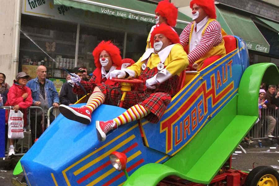 Clowns_in_ Colorful_ Car_at_ Parade.jpg Wallpaper