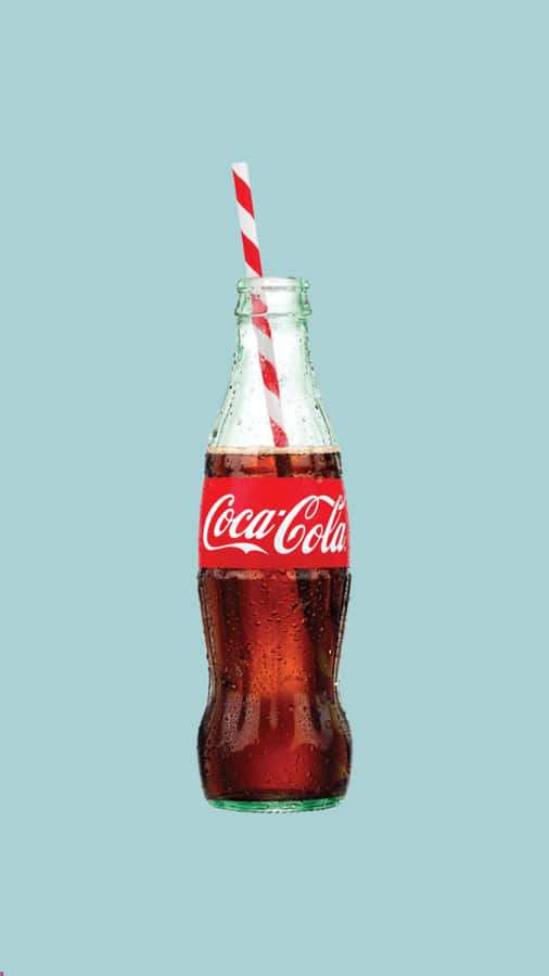 Coca Cola Bottle With A Straw On A Blue Background Wallpaper