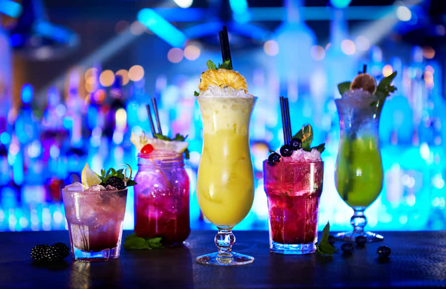 Cocktail Drinks On Blue Light Bar Wallpaper