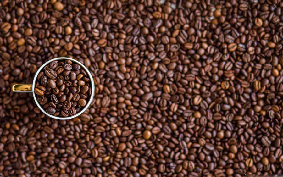 Coffee Beans On Mug Wallpaper