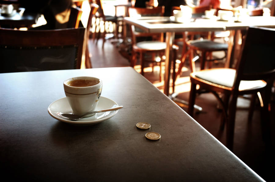 Coins On Coffee Shop Table Wallpaper